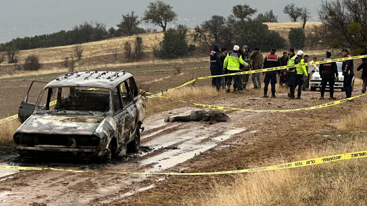Yanmış otomobilin yanında başsız ceset bulundu... Kan donduran olay