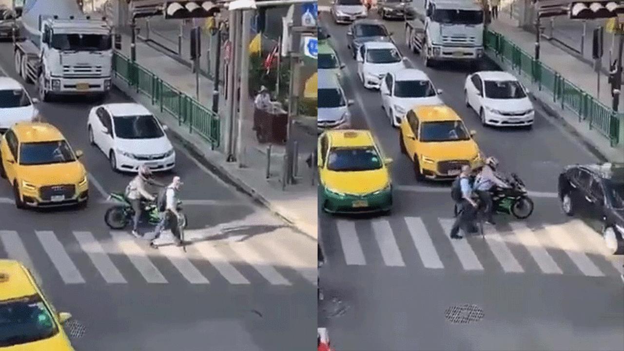 Yaşlı adamı karşıya geçirmek için trafiği kesti