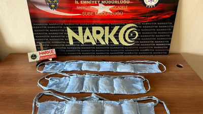 1 kiloluk uyuşturucuyu kıyafetine dikti