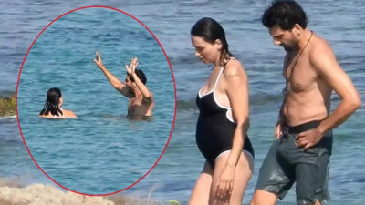 Kaan Urgancıoğlu hamile eşiyle Çeşme'de. Karnı burnunda denize girdi