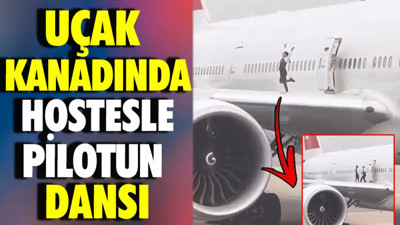 Uçak kanadında hostesle pilotun dansı