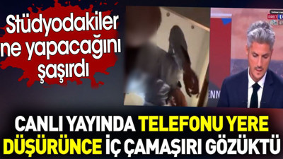 Canlı yayında telefonu yere düşürünce iç çamaşırı gözüktü. Stüdyodakiler ne yapacağını şaşırdı