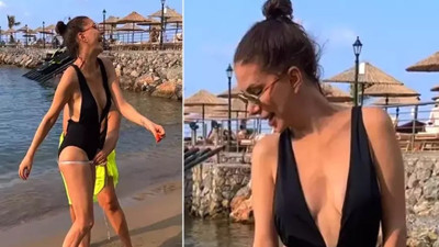 Tuğba Özerk plajda ölçü aldırdı. Genç kızlara taş çıkarttı