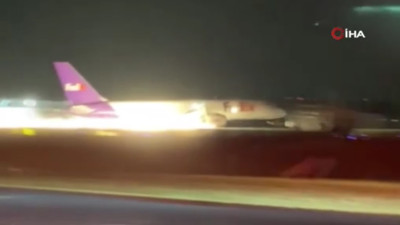 Uçak gövdesinden alevler saçarak indi