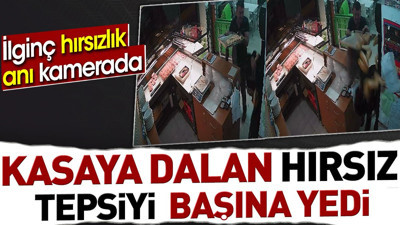 Kasaya dalan hırsız tepsiyi başına yedi. İlginç hırsızlık anı kamerada