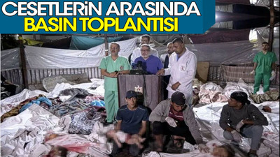 Cesetlerin arasında basın toplantısı. Tarihe geçecek fotoğraf