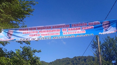 Muhtar adayı yiyeceği haltları dürüstçe pankartta açıkladı