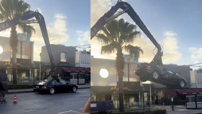 Ataşehir'deki bir mekan sahibi Dükkanının önüne park eden lüks aracı vinçle parçalattı