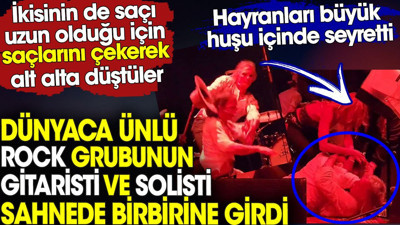 Dünyaca ünlü rock grubunun gitaristi ve solisti sahnede birbirine girdi. Hayranları huşu içinde seyretti