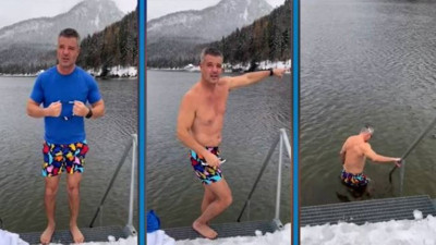 Sadettin Saran karlı havada buz gibi göle girdi. 'Sakın evde denemeyin'