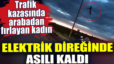 Trafik kazasında arabadan fırlayan kadın elektrik direğinde asılı kaldı