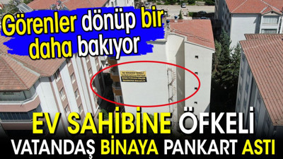 Ev sahibine öfkeli vatandaş binaya pankart astı. Görenler dönüp bir daha bakıyor