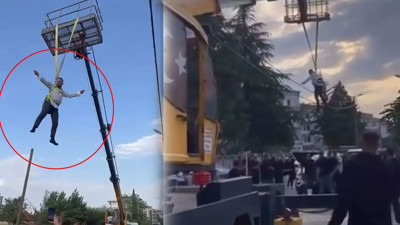 Bursa’da sıra dışı gelenek! Damadı metrelerce yukarı çıkartıp vinçte sallandırdılar!