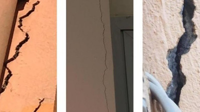 Depremde hasar gören okulun çatlaklarını sıvayla kapattılar!