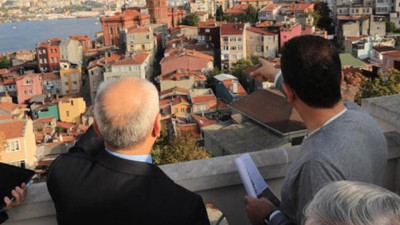 İmamoğlu cemaatin yurt binasını işaret etti...