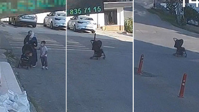 İçinde bebeği bulanan bebek arabasını yokuşta bırakan anne
