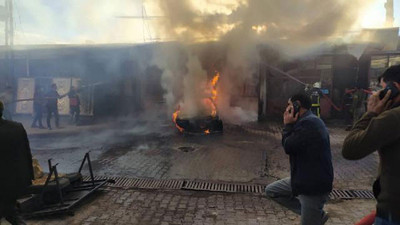 Yanan araç üç iş yerine zarar verdi