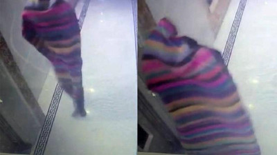 Apartmana giren hırsız kilimle kamufle oldu