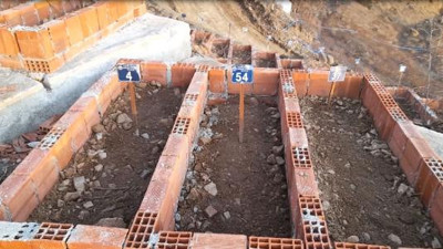 Su altında kalacak Yusufeli'de mezarlar da taşınıyor