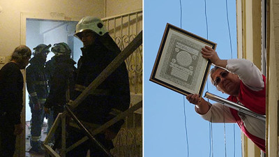 Yangında penceresinden ayet yazılı çerçeve ile dua etti