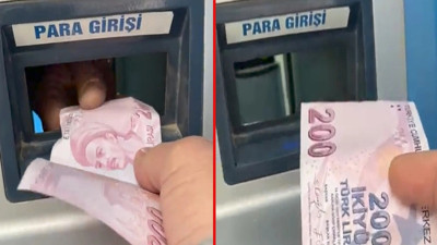 Yatırdığı parayı karşıdan bir el aldı. Neye uğradığını şaşırdı