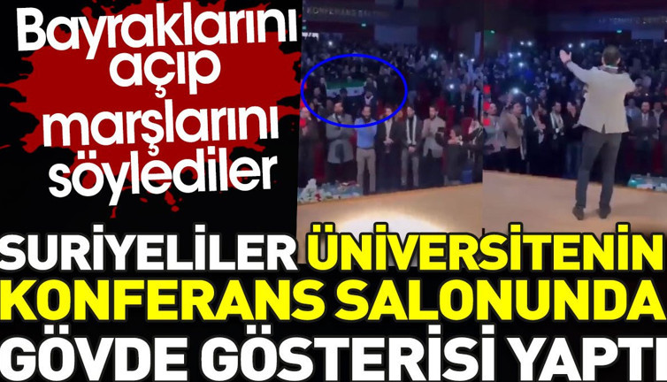Suriyeliler üniversitede gövde gösterisi yaptı. Bayraklarını açıp marşlarını söylediler
