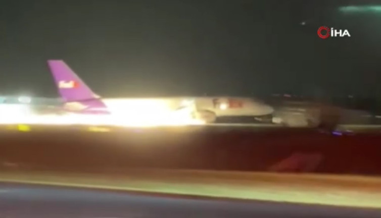 Uçak gövdesinden alevler saçarak indi