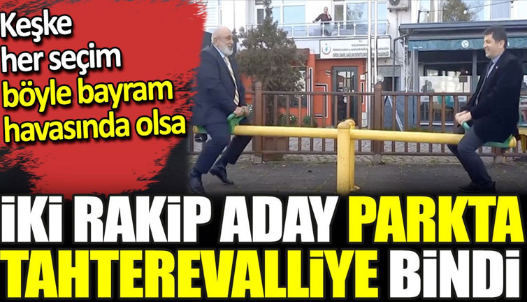 İki rakip aday parkta tahterevalliye bindi. Keşke her seçim böyle bayram havasında olsa