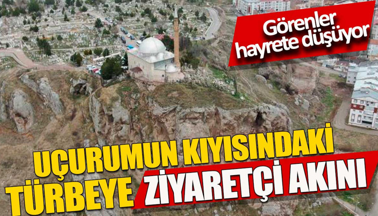 Uçurumun kıyısındaki türbeye ziyaretçi akını. Görenler hayrete düşüyor