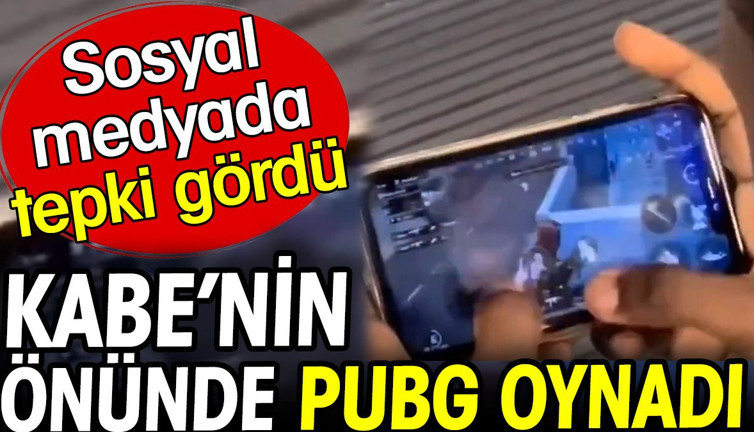 Kabe'nin önünde PUBG oynadı. Sosyal medyada tepki gördü