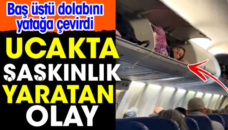 Uçakta şaşkınlık yaratan olay. Baş üstü dolabını yatağa çevirdi
