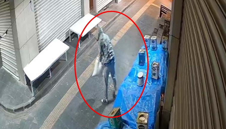 Kapüşonlu hırsız fıstık çuvalını sırtladığı gibi kaçtı